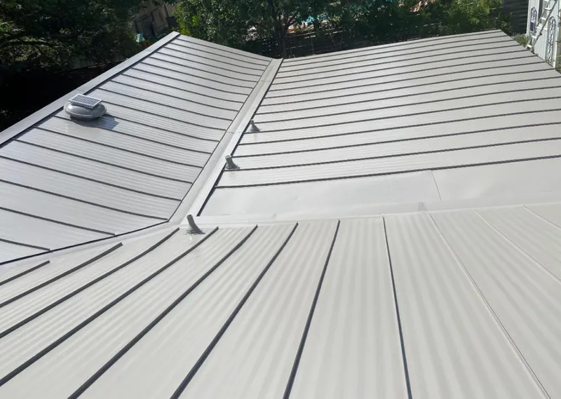 Solar attic fan installed on a metal roof for Roof Ventilation in Point Pleasant Beach